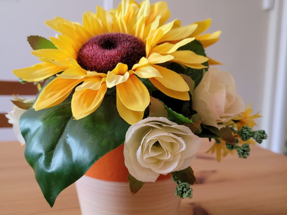 pink room table sunflower and painting